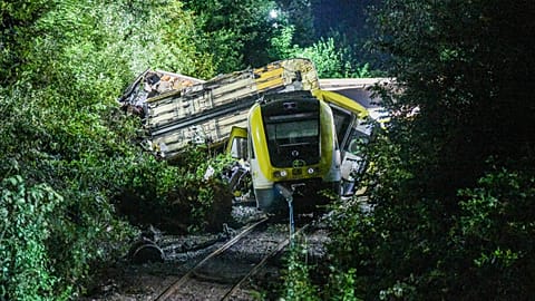 Wagons of a derailed regional passenger train lie on a railroad line near Riedlingen, Germany, early Monday, July 28, 2025.
