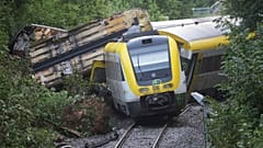 Wagons of a derailed regional passenger train in Germany