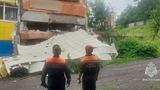 Rescuers inspect a kindergarten damaged by an earthquake in Petropavlovsk-Kamchatsky, Russia, Wednesday, July 30, 2025.