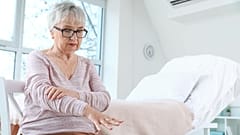 A woman with Parkinson's disease is shown.