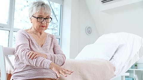 A woman with Parkinson's disease is shown.