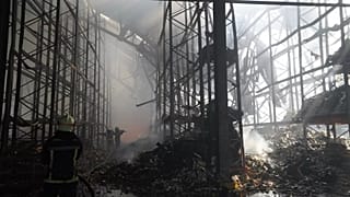 Firefighters tackle the blaze after a Russian air attack that hit a food warehouse in Kharkiv, 30 July, 2025
