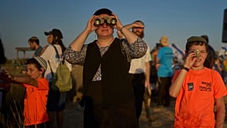Israeli right-wing activists attend a rally calling for the re-establishment of Jewish settlements in the Gaza Strip, near the border in southern Israel, July 30, 2025.