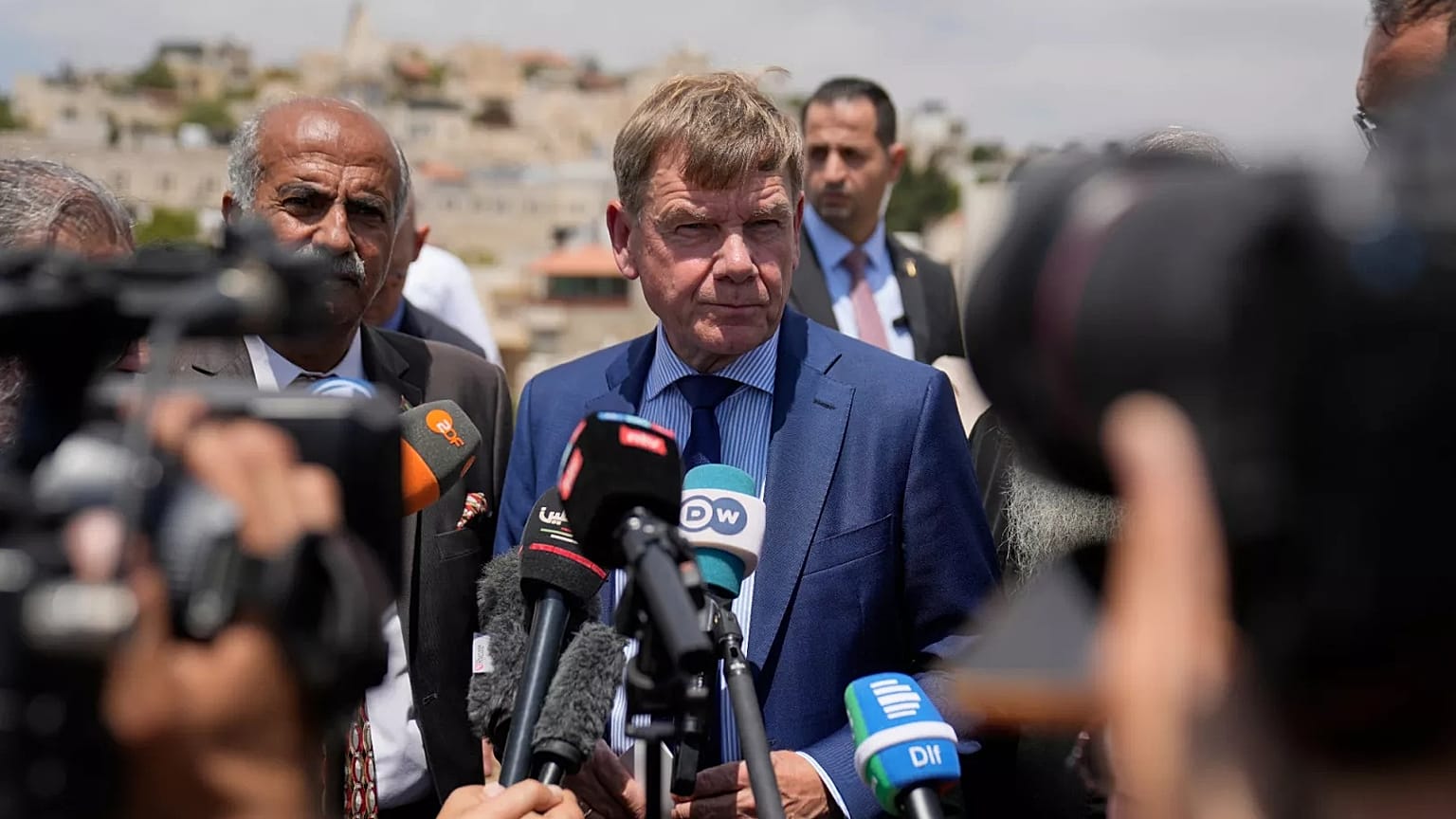 Johann Wadephul speaks to the media in the archaeological site of the Church of St. George in the West Bank, 1 August, 2025