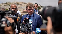 Johann Wadephul speaks to the media in the archaeological site of the Church of St. George in the West Bank, 1 August, 2025
