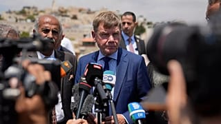 Johann Wadephul speaks to the media in the archaeological site of the Church of St. George in the West Bank, 1 August, 2025