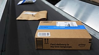 Packages move along a conveyer system at an Amazon Pharmacy fulfillment centre. 29 July 2025. Michigan.