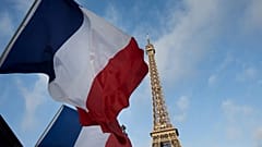 FILE: French flags fly in front of the Eiffel Tower in Paris, 15 November 2015