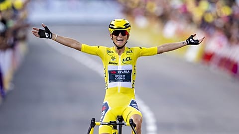 The winner of the Tour de France Femmes Pauline Ferrand-Prevot from France of team Visma - Lease a Bike celebrates as she crosses the finish line