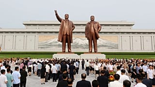 FILE: People pay respect to the statues of former North Korean leaders Kim Il Sung and Kim Jong Il on Mansu Hill in Pyongyang, 8 July 2025