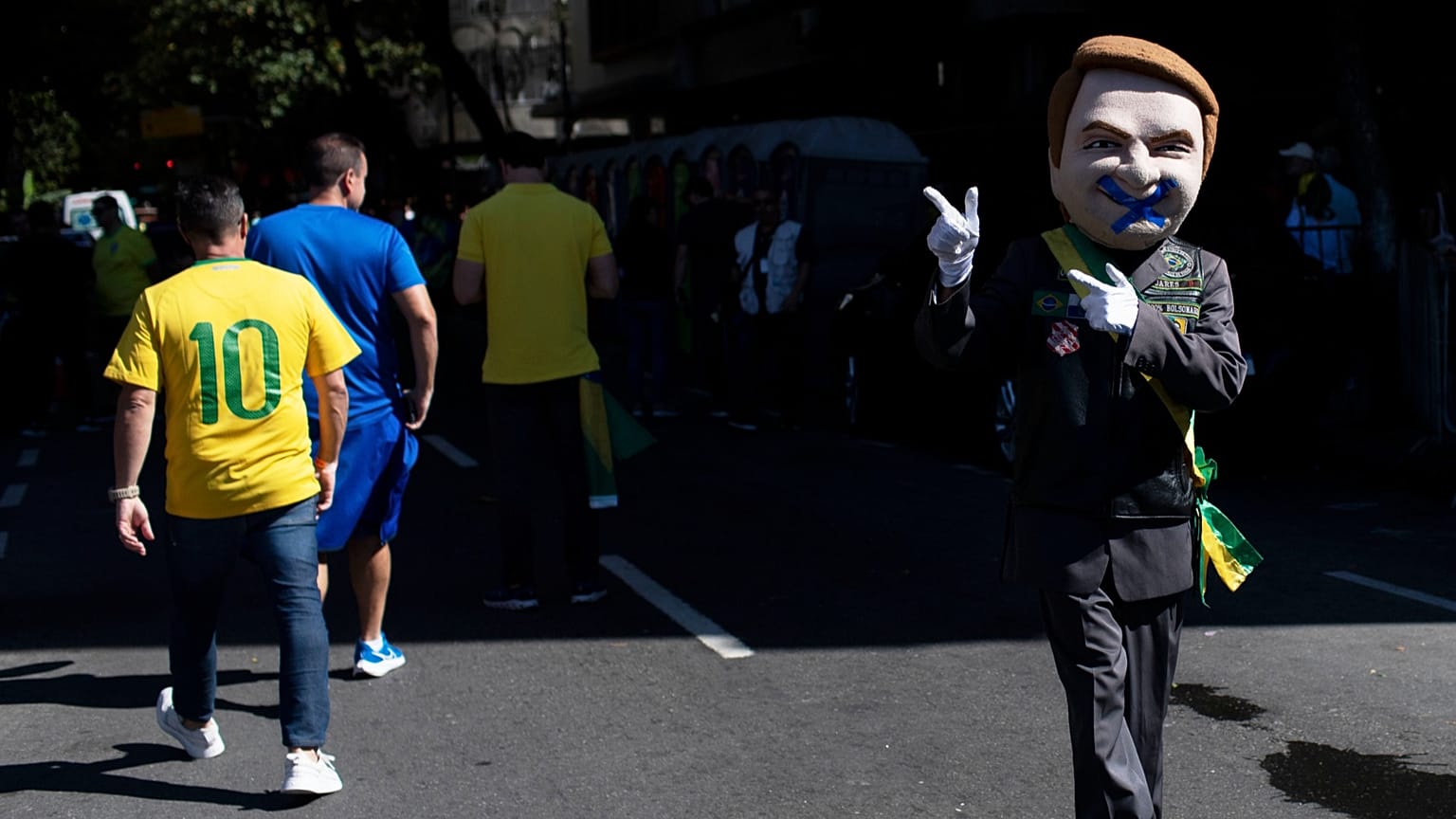 A supporter dressed as former President Jair Bolsonaro attends a protest at Copacabana Beach in Rio de Janeiro, 3 August 2025