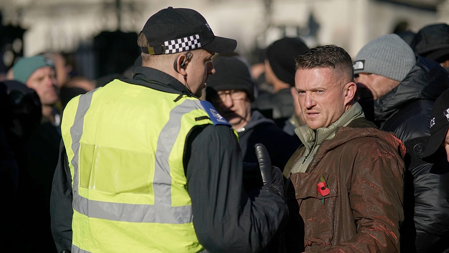 FILE: Far-right figurehead Tommy Robinson speaks to a police officer in London, 11 November 2023