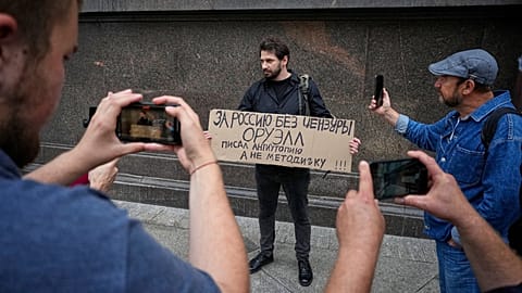 An activist holds a sign protesting censorship during a protest in Moscow, Russia, on July 22, 2025.