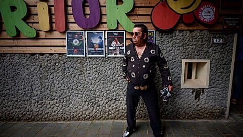 Tudor Lakatos, who goes by the stage name Elvis Rromano, poses outside the Terasa Florilor restaurant before a performance in Bucharest