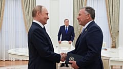 Russian President Vladimir Putin, left, and U.S. President Donald Trump's special envoy Steve Witkoff, right, shake hands during their meeting in Moscow, Russia, Wednesday, Au