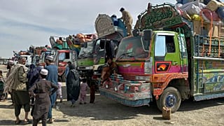 Afghan refugees wait for clearance to leave for their homeland at a transit station on the outskirts of Chaman, 9 April, 2025