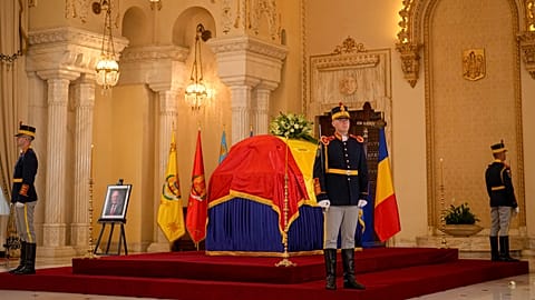 Honour guard soldiers stand next to the coffin of the late Ion Iliescu at the Cotroceni Presidential Palace, in Bucharest, 6 August 2025