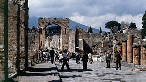 Tourists walk through Pompeii near the Villa of Mysteries in Italy, 20 March 2015.