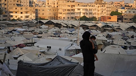A tent camp for displaced Palestinians stretches along Gaza City, Sunday, Aug. 3, 2025. 