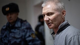 Aleksey Moskalyov is escorted from a courtroom in Yefremov, Tula region, 27 March 2023