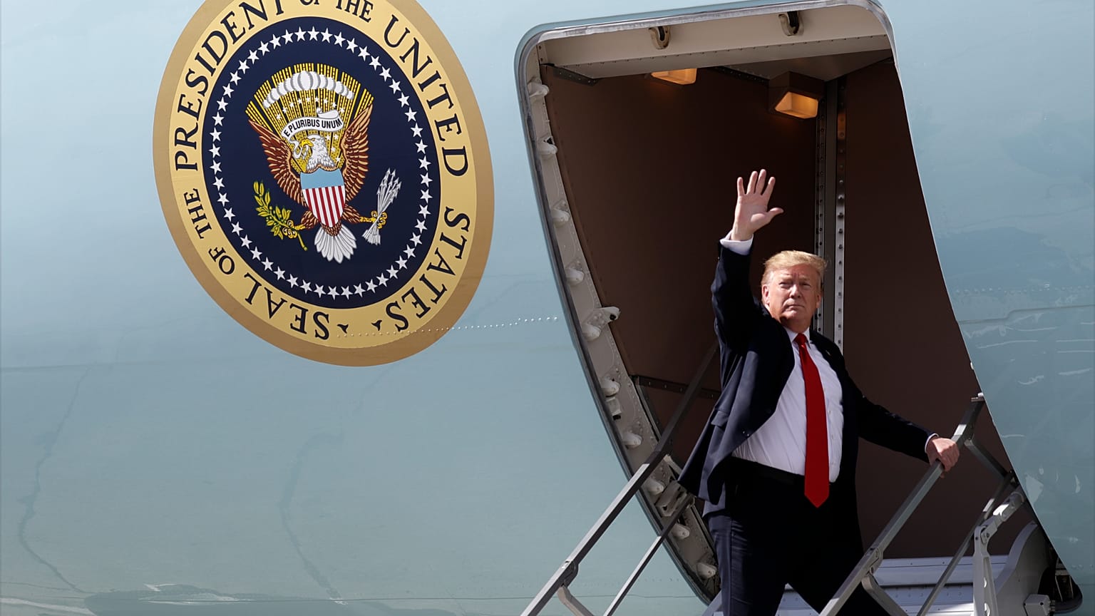 FILE: President Donald Trump waves after greeting troops at Joint Base Elmendorf-Richardson in Anchorage, 24 May 2019
