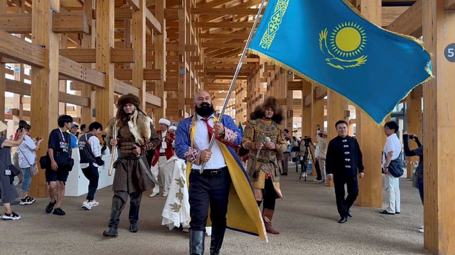 The celebrations opened with a parade led by strongman and four-time world record-holder Sergey Tsyrulnikov carrying the national flag, joined by Kazakh warriors (batyrs) 