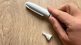 A person holds a tirzepatide injection.