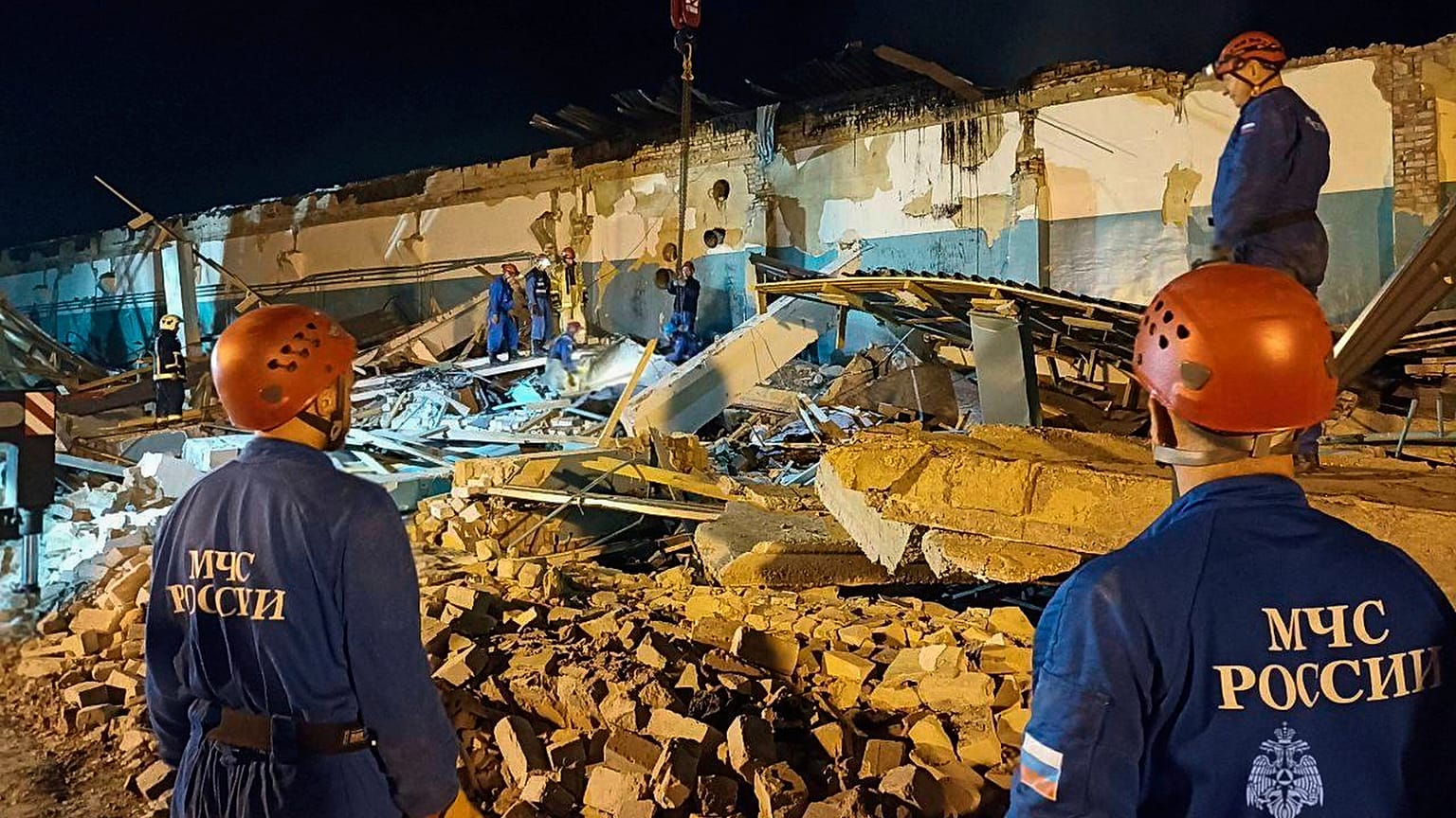 Emergency Ministry employees work in debris of an industrial plant after a fire at the facility in the Shilovsky District, Ryazan region, Russia, Aug. 16, 2025.