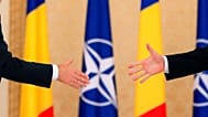 NATO Secretary-General Jens Stoltenberg reaches to shake hands with Romanian President Klaus Iohannis after a media statement in Bucharest, Romania, 31 Jan 2019