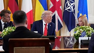 US President Donald Trump, center, speaks with Italy's Prime Minister Giorgia Meloni, right, and France's President Emmanuel Macron, left at the White House on 18 Aug 2025.