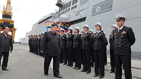 In this photo provided by the North Korean government, North Korean leader Kim Jong Un, center, the warship Choe Hyon in Nampo, North Korea, on Aug. 18, 2025.