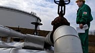 FILE - Istvan Szekeres, engineer of the Hungarian Oil and Gas Company (MOL) checks the receiving area of the Druzhba oil pipeline in the country's largest oil refinery in Szaz