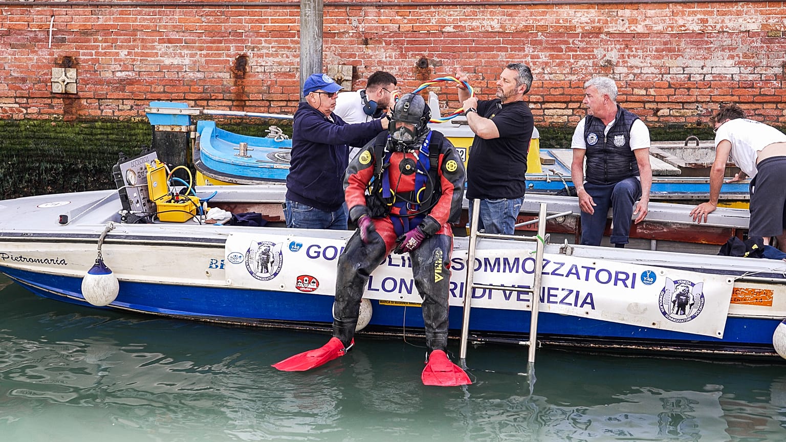Watch: The gondoliers dive deep to reclaim Venice’s beauty