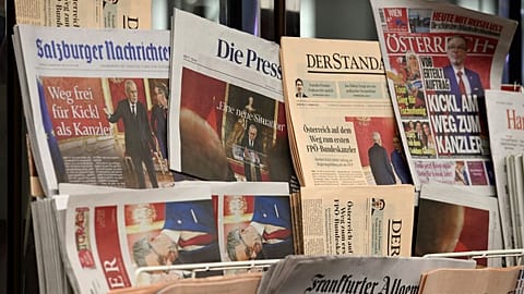 Newspapers are seen on a sales stand in Vienna.