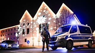 FILE: A police officer guards at a blocked road near a Christmas market after an incident in Magdeburg, 24 December 2024