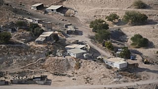 Palestinian hamlets are seen at the E1 area, between the Israeli settlement of Maale Adumim and the occupied West Bank town of Eizariya Thursday, Aug. 14, 2025. 