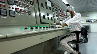 A technician works at the Uranium Conversion Facility just outside the city of Isfahan, 3 February 2007