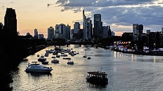 Boats sit in the water on the river Main as an orchestra performs during an open-air classic concert in Frankfurt, Germany. 21 August 2025.