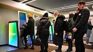 ARCHIVE. Russians withdraw cash a day after Russian army's full-scale invasion of Ukraine