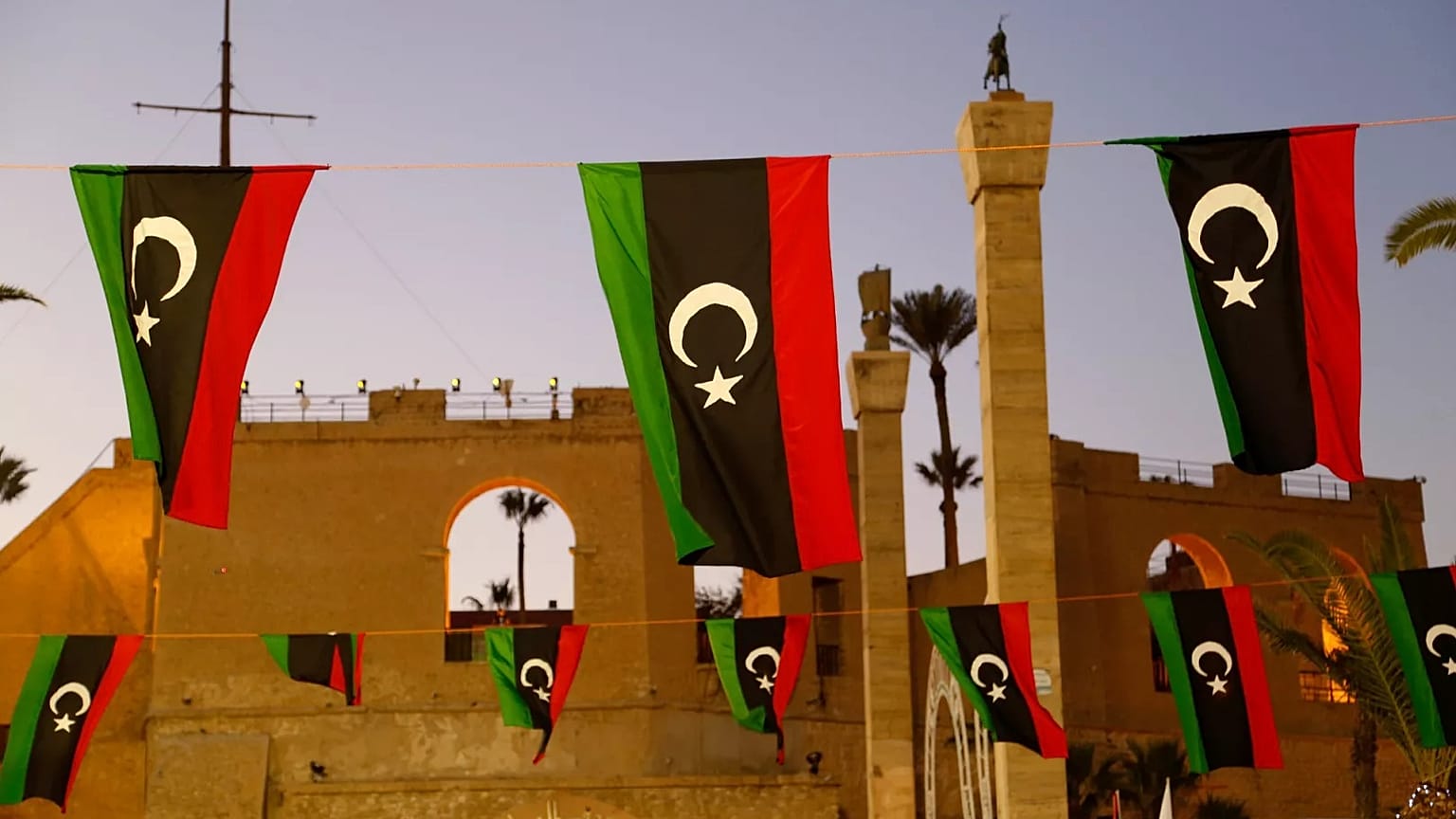 Libyan flags are displayed as people celebrate the February Revolution Day in Martyrs' Square in Tripoli, 18 February, 2022