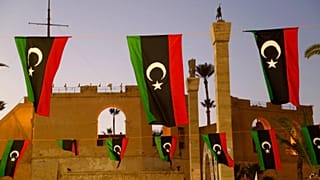Libyan flags are displayed as people celebrate the February Revolution Day in Martyrs' Square in Tripoli, 18 February, 2022