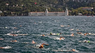 Competitors take part in a 6.5 km swimming race across the Bosphorus Strait in Istanbul, 25 August, 2025