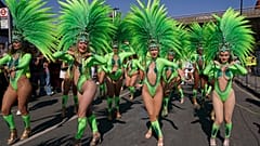 Revellers parade during London's Notting Hill Carnival, Europe's biggest street party, 25 August 2025 