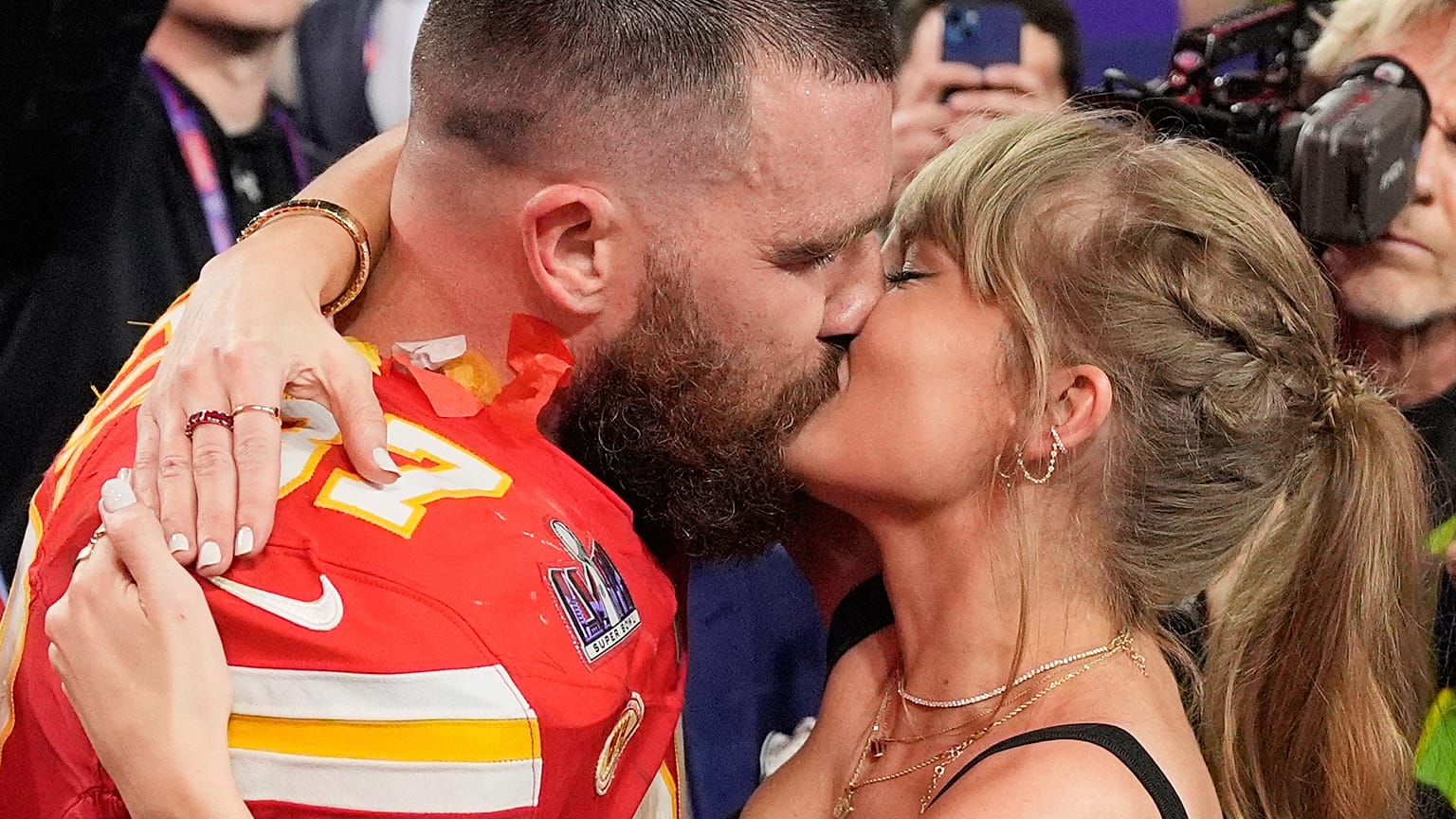 Kansas City Chiefs tight end Travis Kelce and singer Taylor Swift kiss after the NFL Super Bowl 58 football game in Las Vegas. 11 Feb. 2024.
