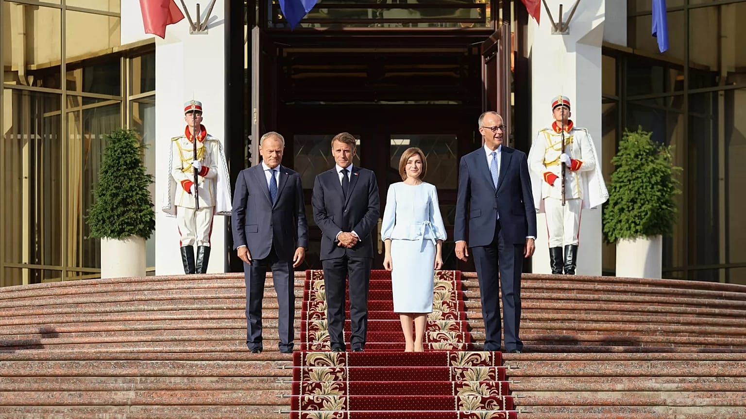 From left, Polish Prime Minister Donald TUsk, French President Emmanuel Macron, Moldova's President Maia Sandu and German Chancellor Friedrich Merz leave the country's preside