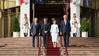 From left, Polish Prime Minister Donald TUsk, French President Emmanuel Macron, Moldova's President Maia Sandu and German Chancellor Friedrich Merz leave the country's preside