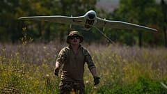 A Ukrainian serviceman of the Ochi reconnaissance unit launches a Furia drone to fly over Russian positions at the frontline in Donetsk region, Ukraine, on Sunday, June 30, 20