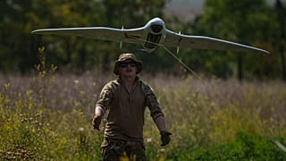 A Ukrainian serviceman of the Ochi reconnaissance unit launches a Furia drone to fly over Russian positions at the frontline in Donetsk region, Ukraine, on Sunday, June 30, 20