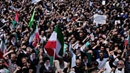 هواداران حکومت ایران در یک راهپیمایی در این کشور
