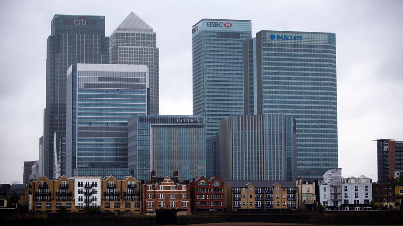 An exterior view shows the headquarters building of Barclays Bank, 1 Churchill Place, at right, in the Canary Wharf business district of London, Thursday, May 8, 2014. 